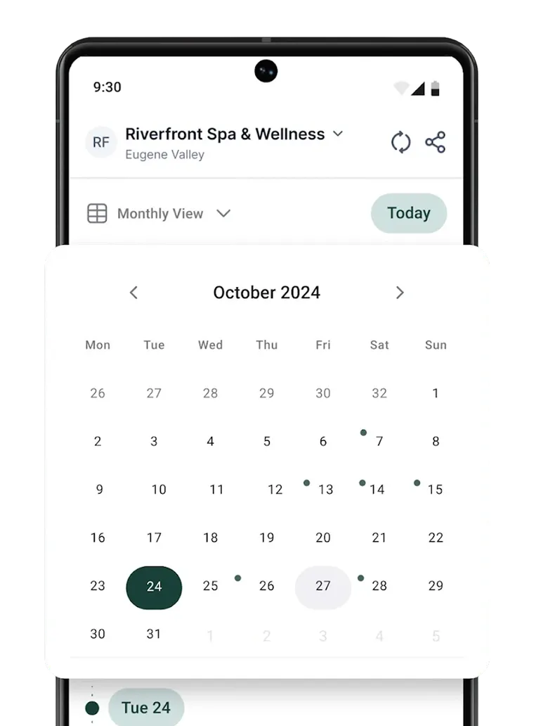 The app calendar in month view with booked days marked.